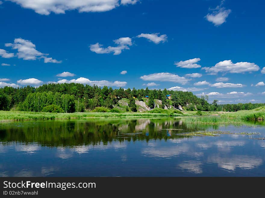 Beautiful big  anoramic landscape with green grass and blue sky. Beautiful big  anoramic landscape with green grass and blue sky