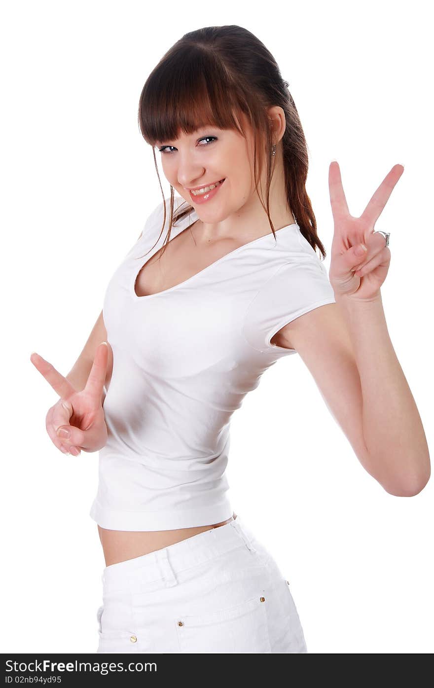 A charming young girl in a white T-shirt makes a sports exercise isolated on white