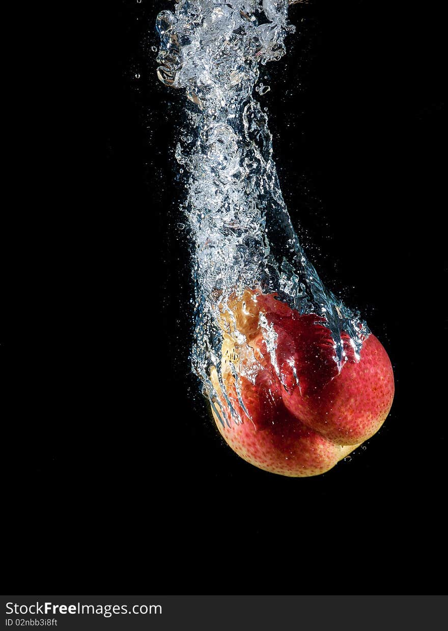 Pear dropped into water