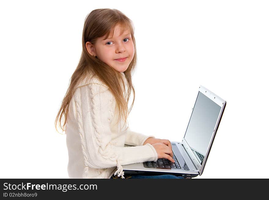 Little girl with the laptop on white