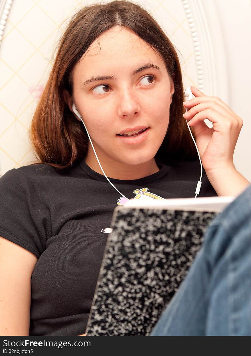 Girl Listening to Music While Studying. Girl Listening to Music While Studying