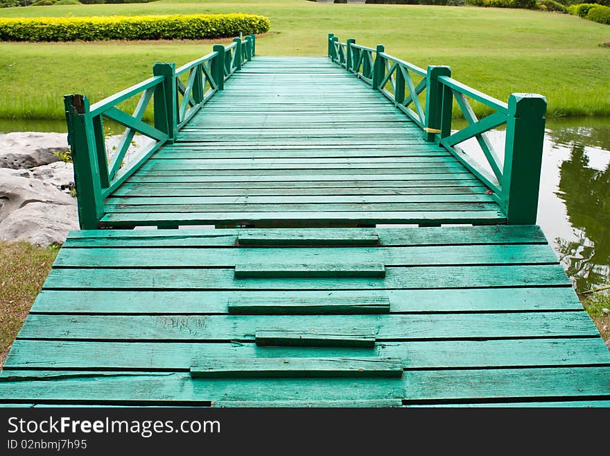 Bridge and the yard in the park,grass green