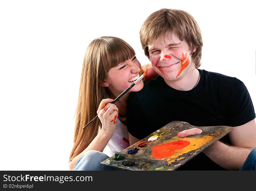 Young Couple Playing With Painting