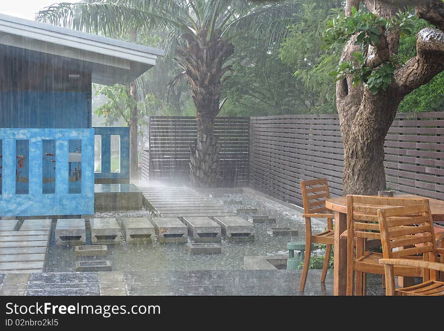 Bathroom outdoors in the garden in rain.