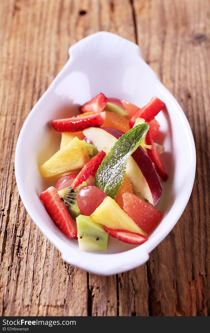 Bowl of fresh mixed fruit salad - detail