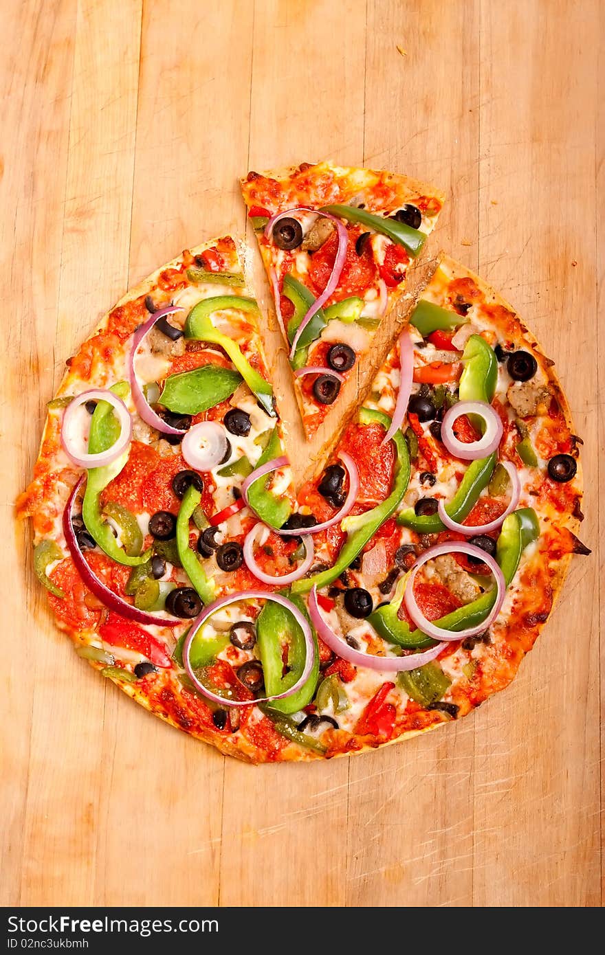 Pizza with vegetables and pepperoni