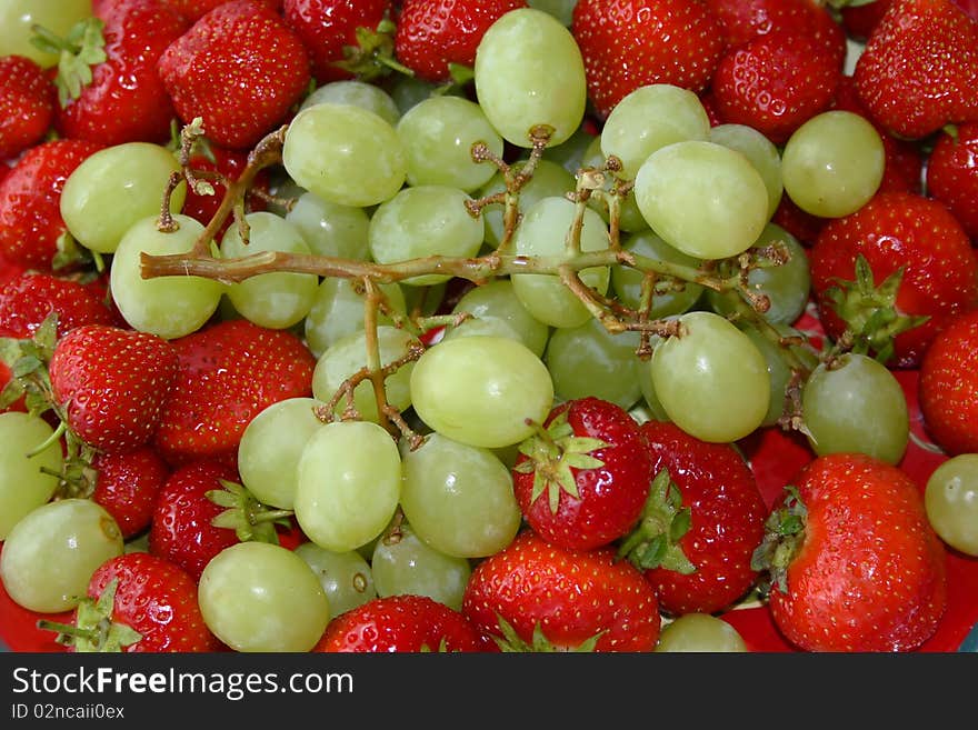 Fresh healthy strawberries and grapes. Fresh healthy strawberries and grapes