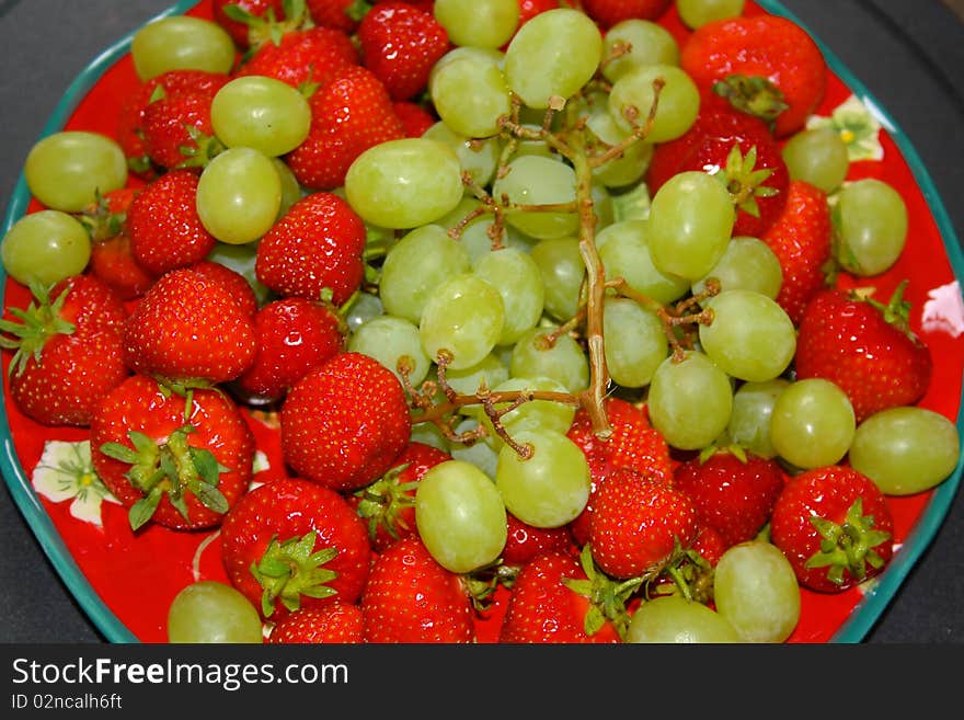 Fresh healthy strawberries and grapes. Fresh healthy strawberries and grapes