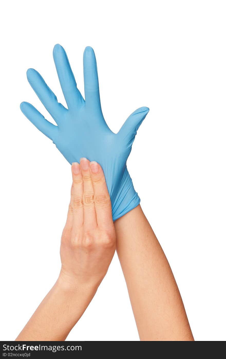 Doctor putting on blue sterilized medical glove for making operation