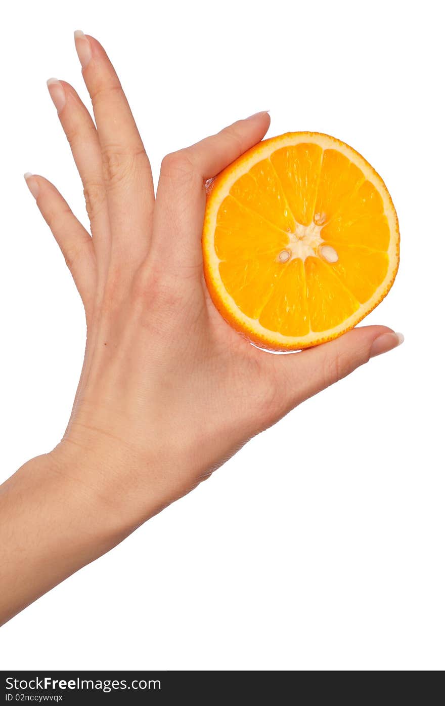 Slice of a fresh Sicilian orange in the hand