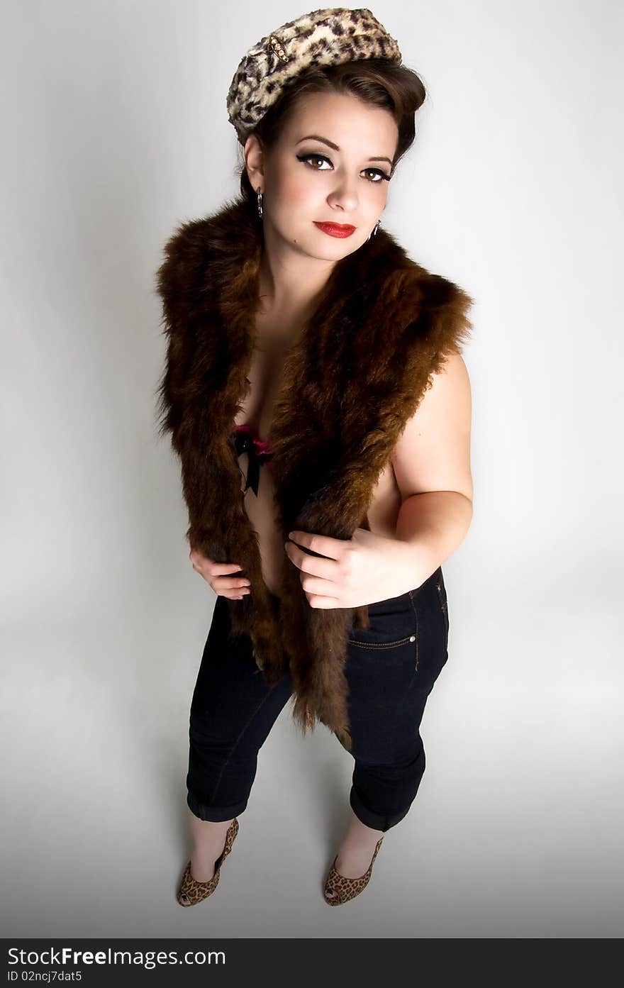 woman wearing fur stole and vintage animal print hat. woman wearing fur stole and vintage animal print hat