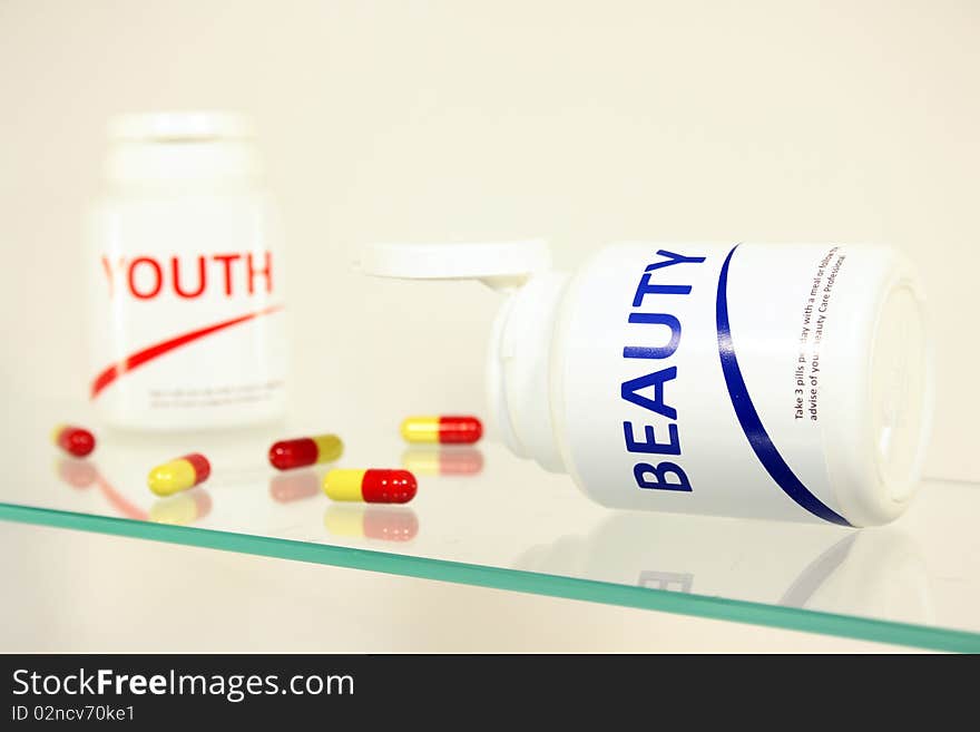 Beauty and youth pills in a bottle on bathroom shelf, fake brands