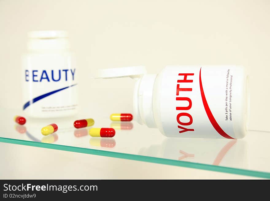 Youth and beauty pills in a bottle on bathroom shelf, fake brands