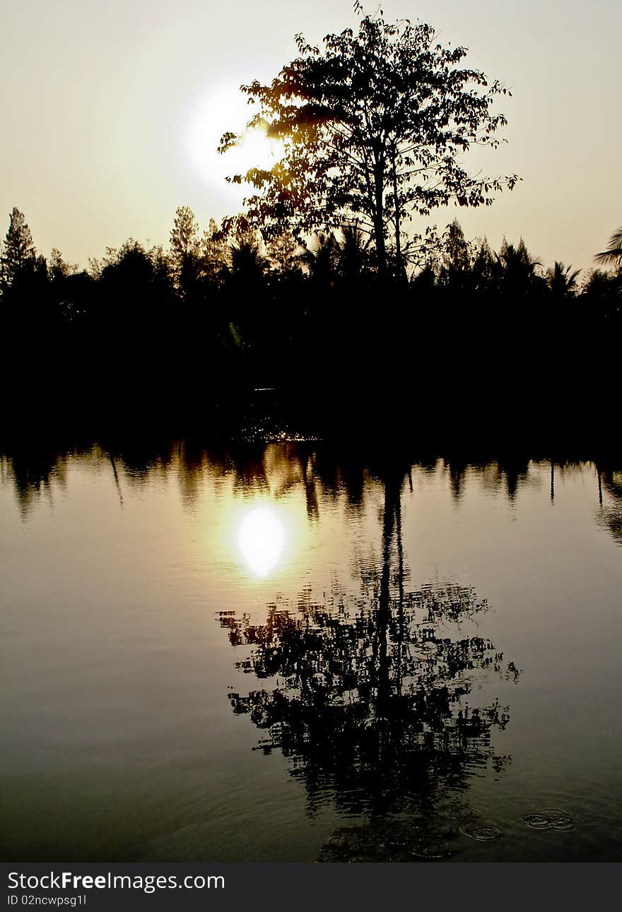 Golden sunset over the lake on the east coast of Thailand