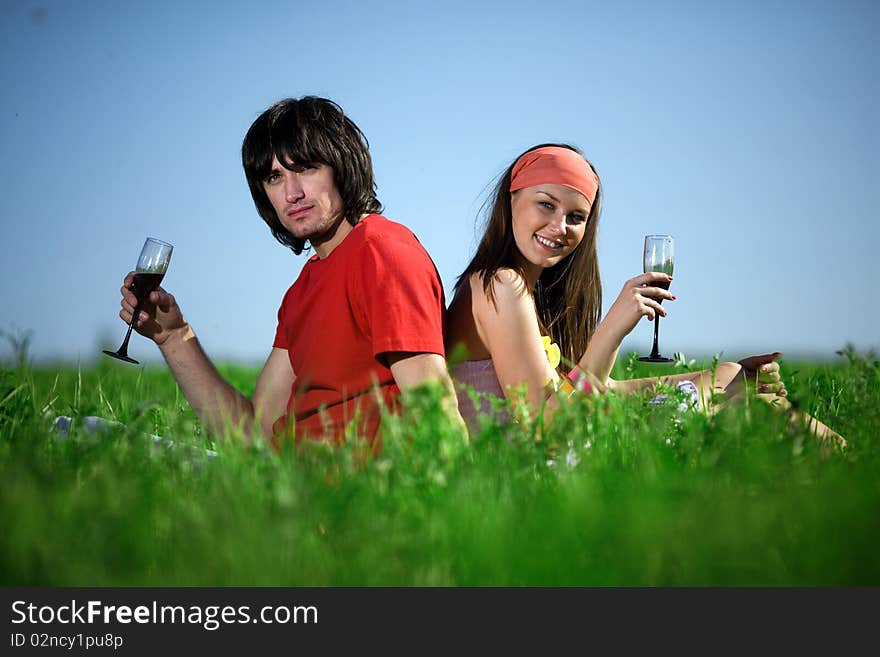 Nice girl with smile and boy with wineglasses. Nice girl with smile and boy with wineglasses