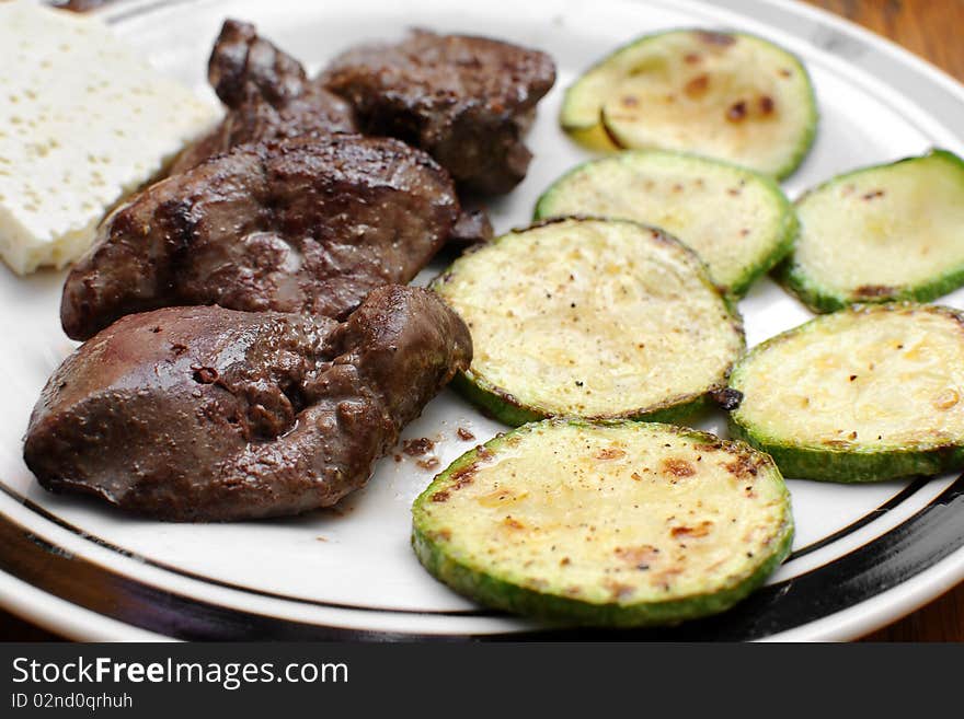 Panfried green zucchini with chicken liver