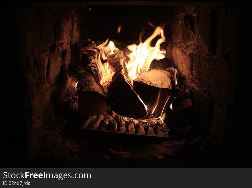 Burning Firewood In A Fireplace.