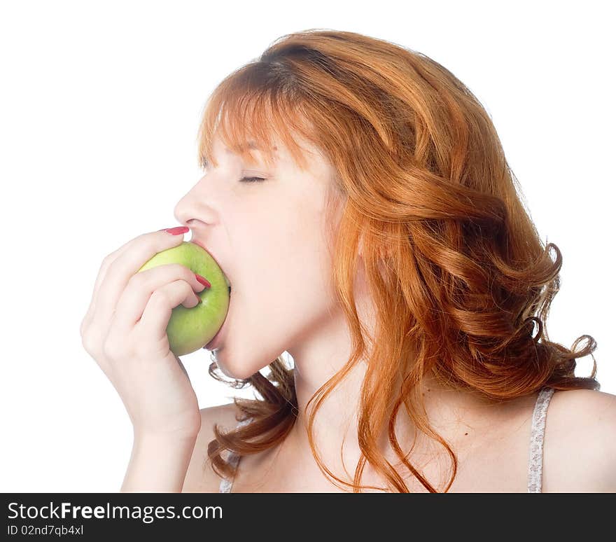 A beautiful young woman biting a fresh green apple. A beautiful young woman biting a fresh green apple.