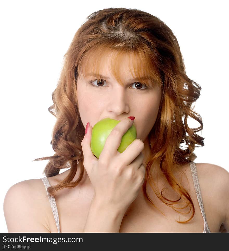 A beautiful young woman biting a fresh green apple. A beautiful young woman biting a fresh green apple.