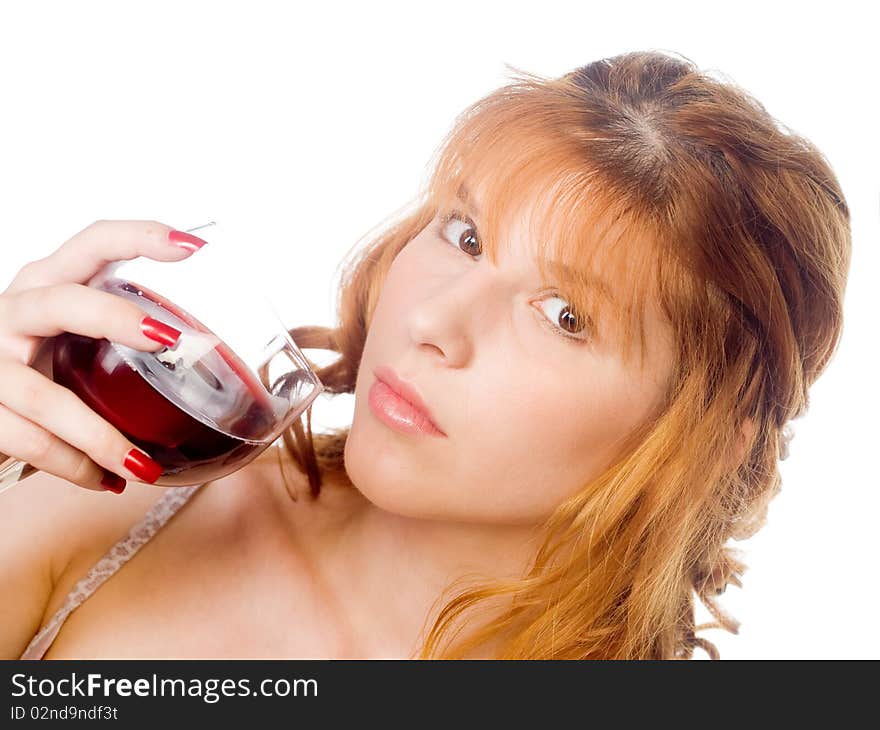 Healthy redhead young woman holding glass of red wine