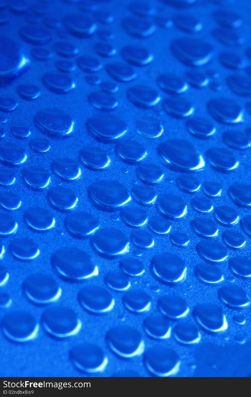 Water drop inside the bottle blue color. Water drop inside the bottle blue color