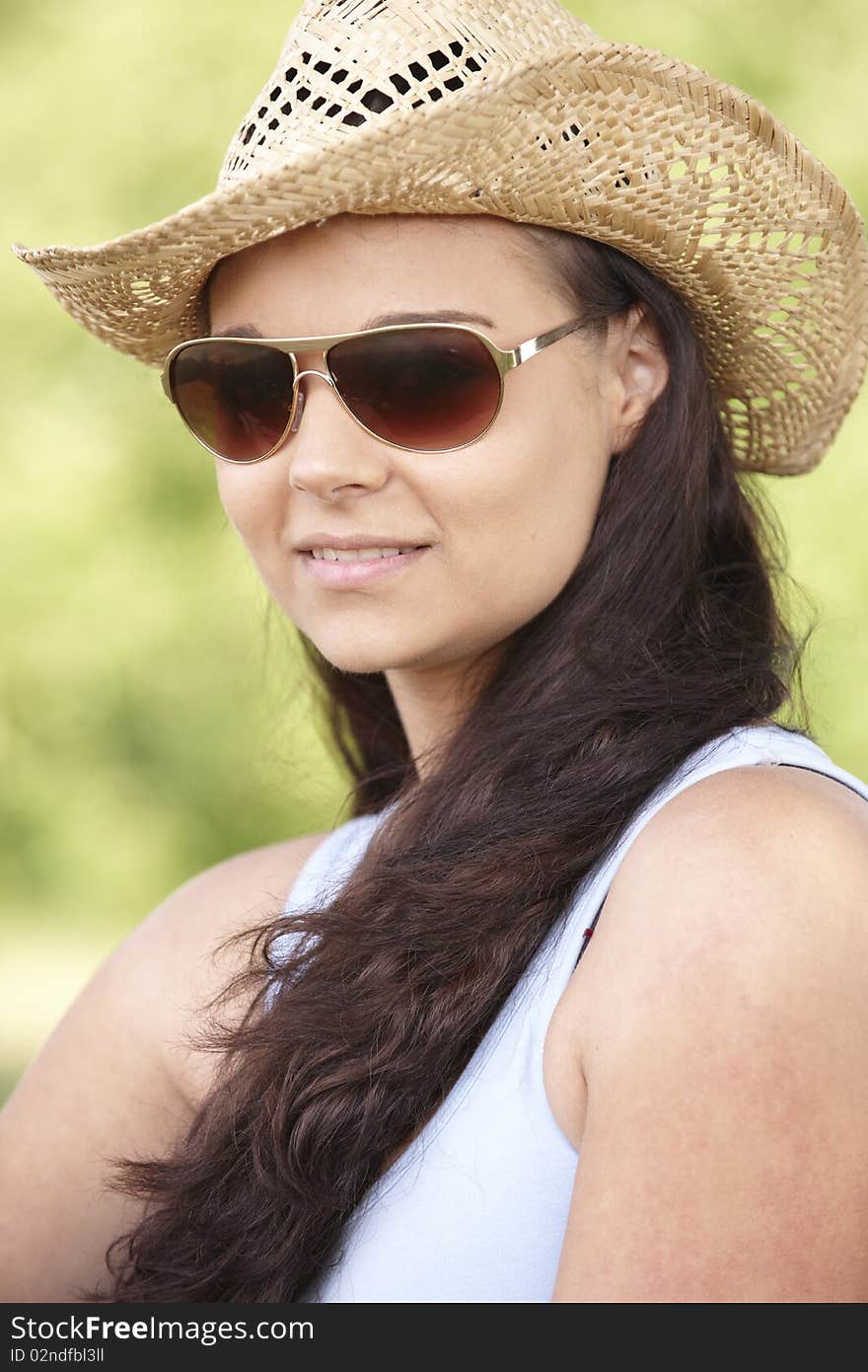 Girl wearing hat and sunglasses