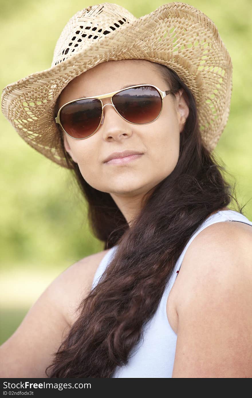 Girl wearing hat and sunglasses