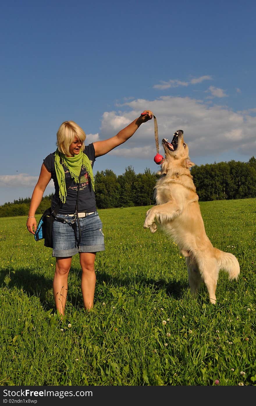 Woman Playing With Her Dog