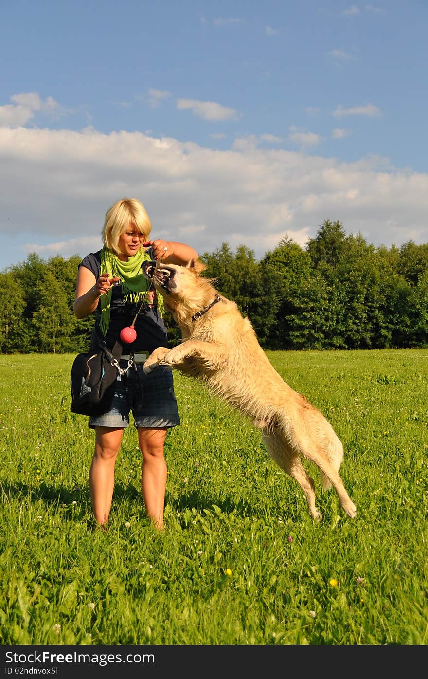 Woman playing with her dog