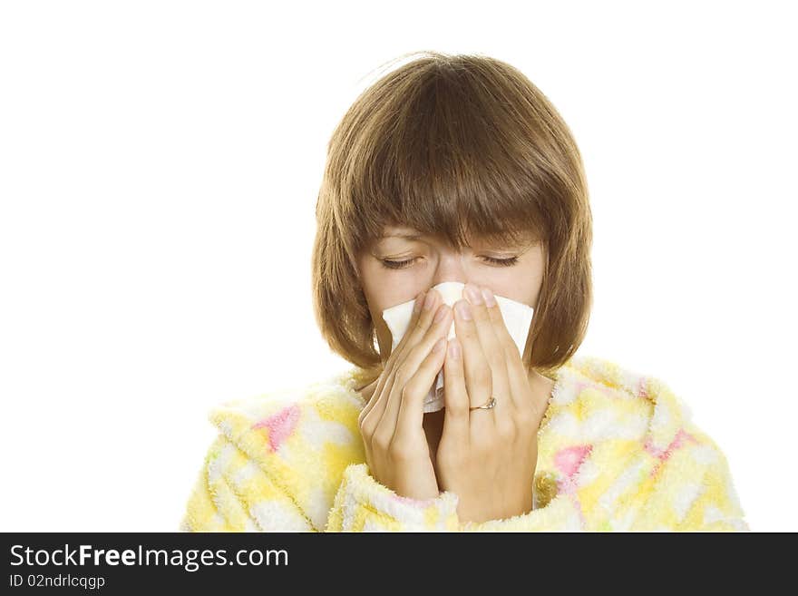 Woman in dressing gown holding a handkerchief around his nose. Isolated on white background. Woman in dressing gown holding a handkerchief around his nose. Isolated on white background