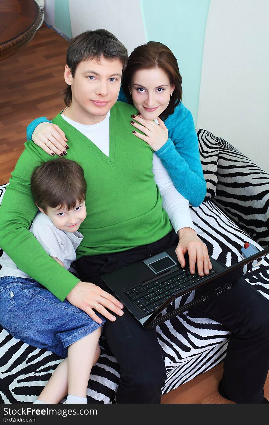 Happy family with a child at home. Happy family with a child at home.