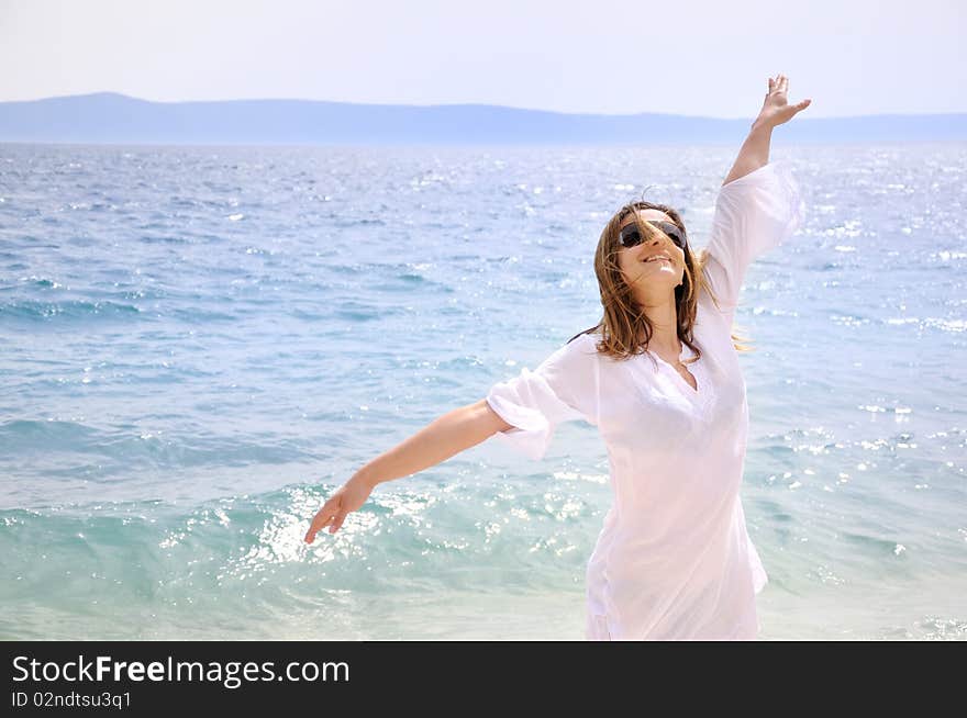 Beautiful young woman on the beach