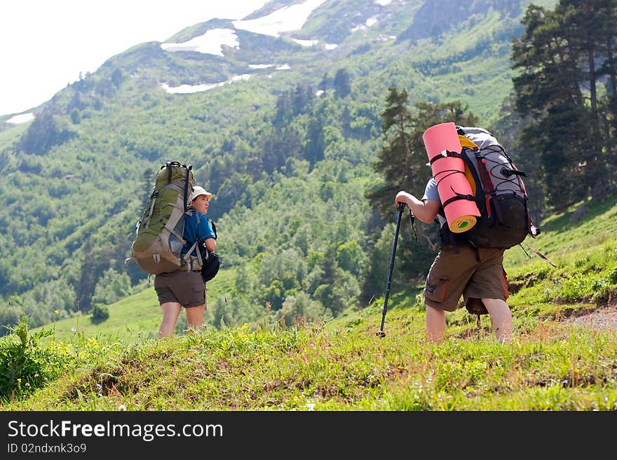 Hiker family in Caucasus mountains