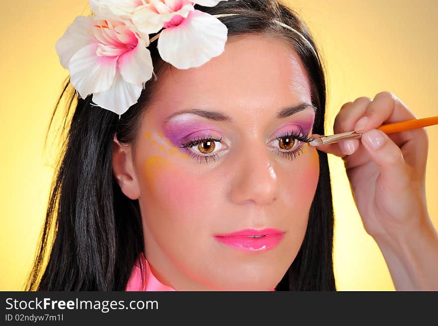 Close-up fashion shot of woman face with creative make-up