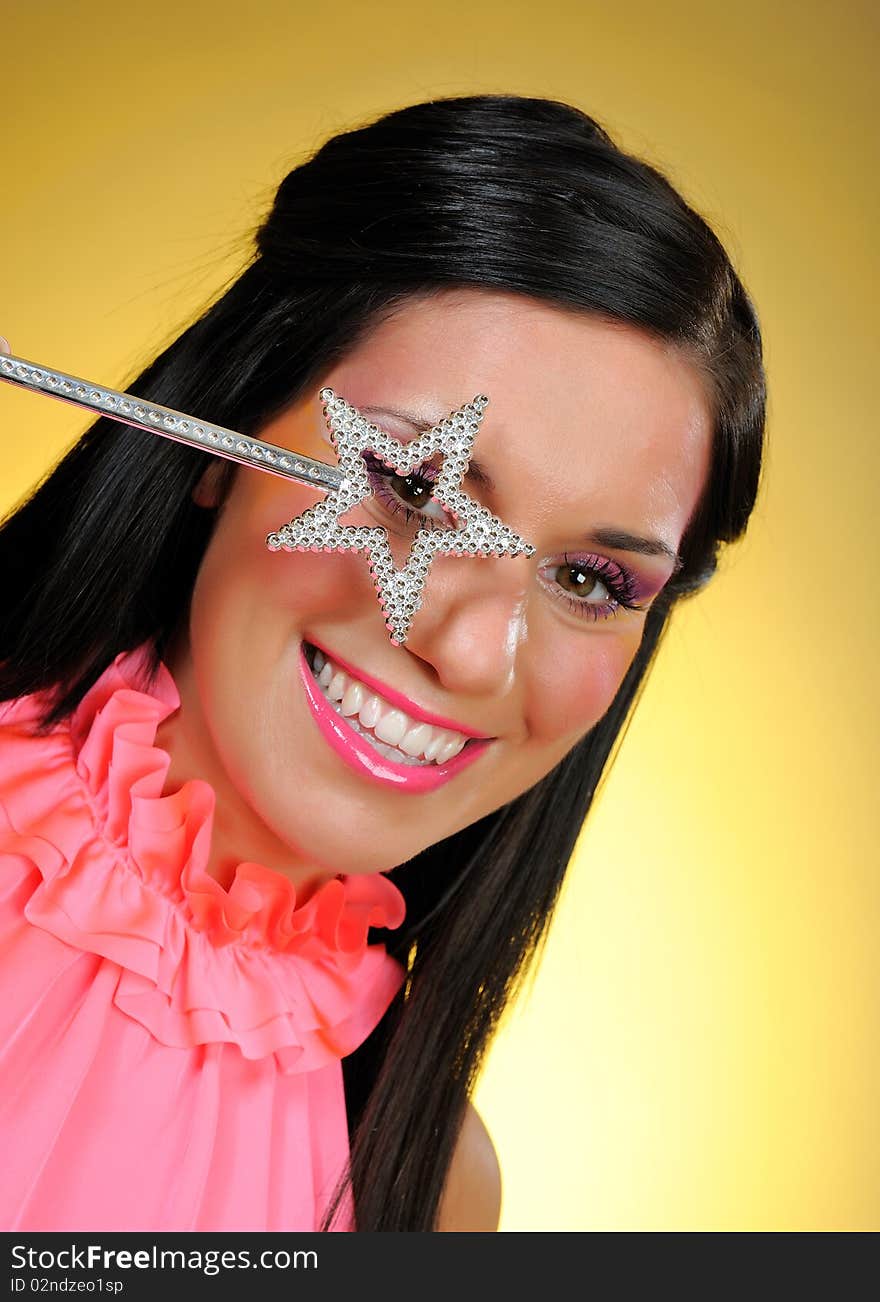 Beautiful woman with creative make-up and the star making a wish. focus on star. Beautiful woman with creative make-up and the star making a wish. focus on star