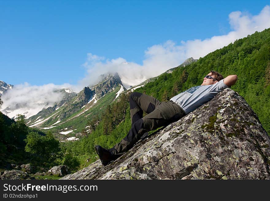 Hiker boy in Caucasus mountains