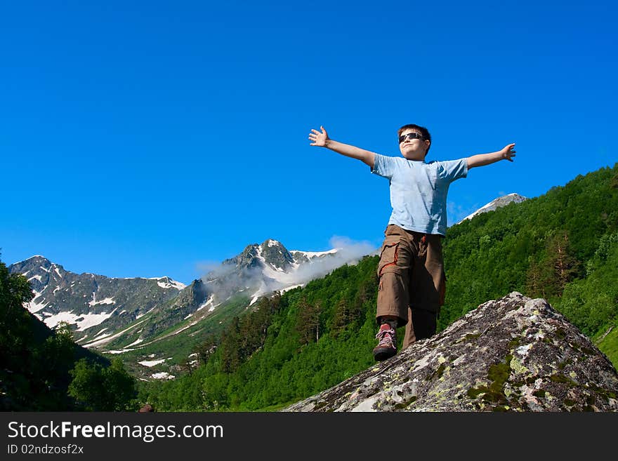 Hiker boy in Caucasus mountains