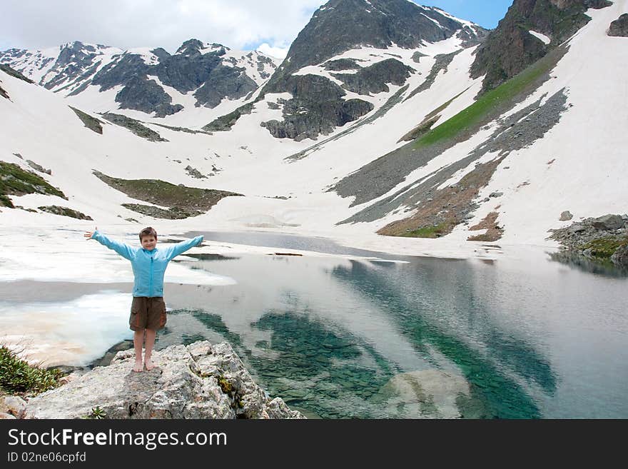 Hiker boy in Caucasus mountains