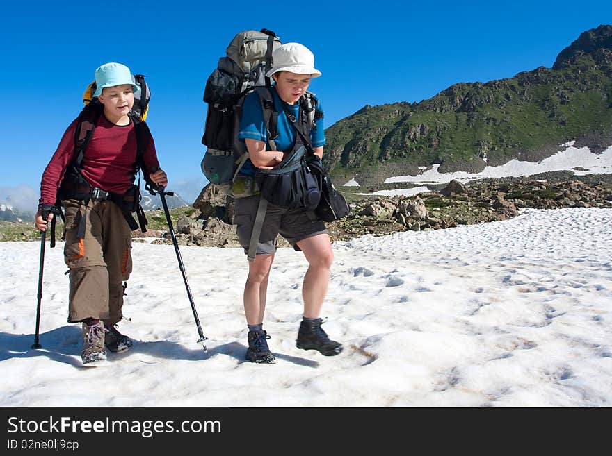 Hiker family in Caucasus mountains