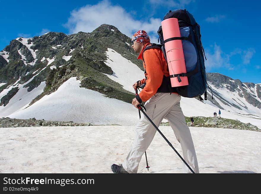 Hiker boy in Caucasus mountains