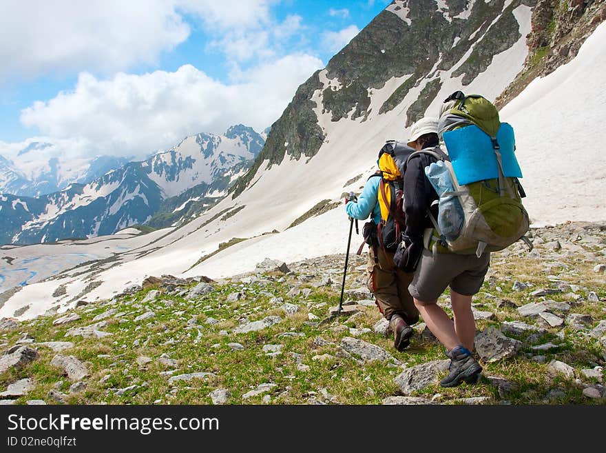 Hiker family in Caucasus mountains