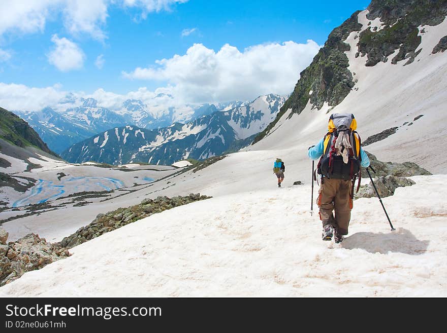 Hiker family in Caucasus mountains