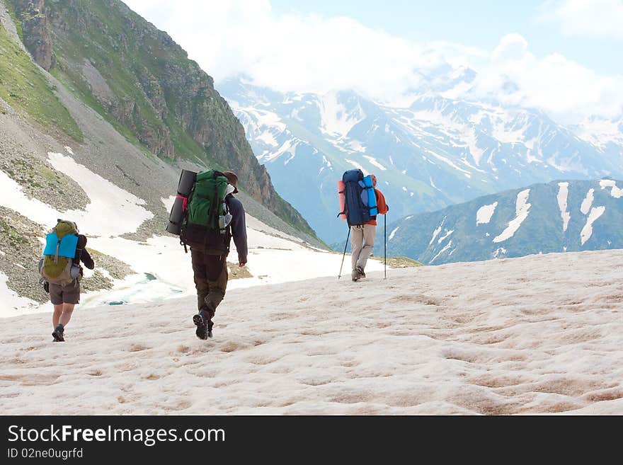 Hiker family in Caucasus mountains