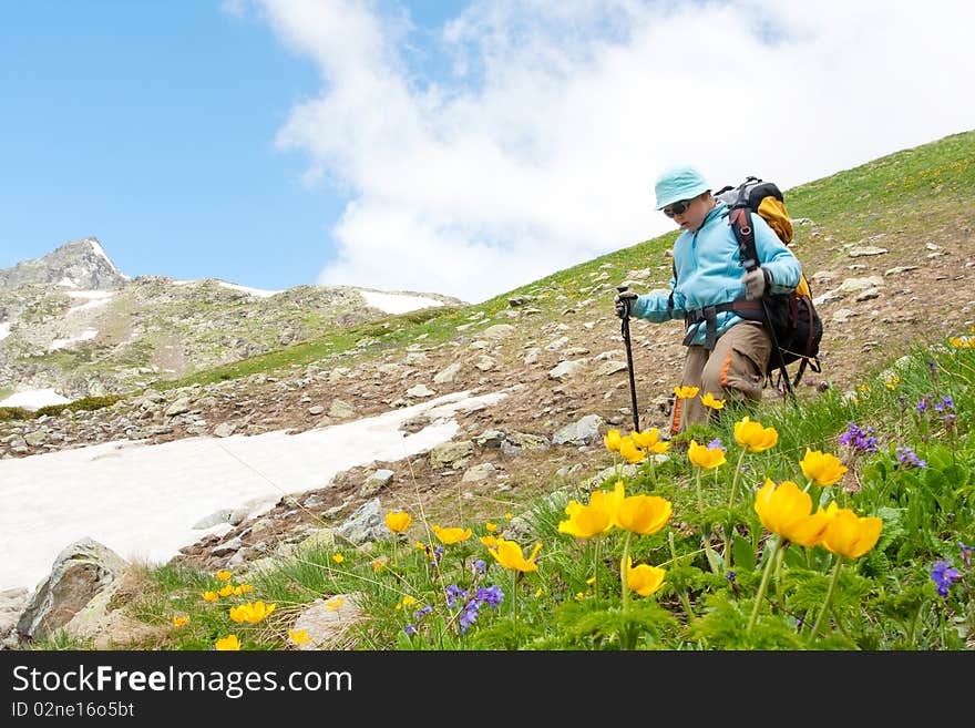 Hiker boy in Caucasus mountains