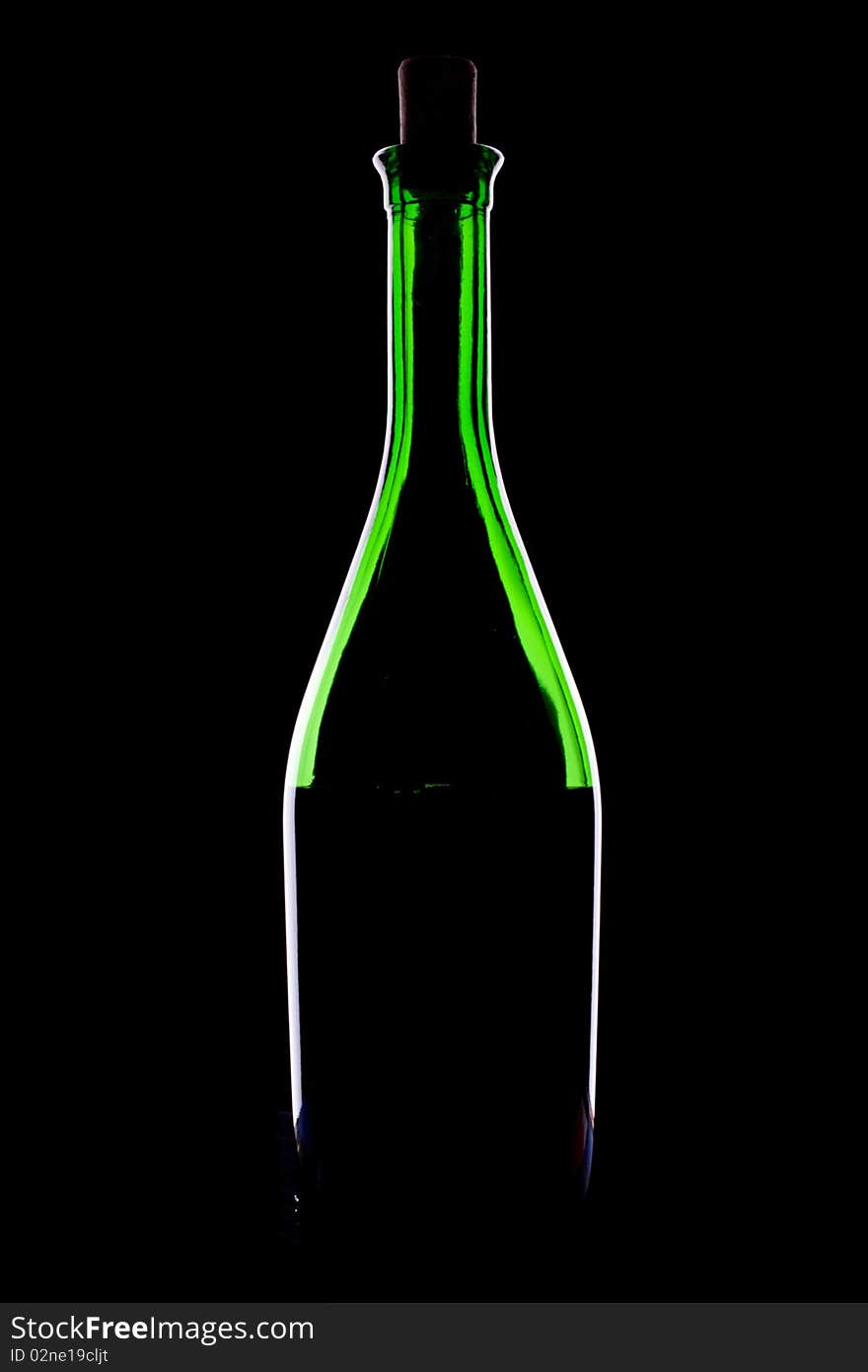 Green glacc bottle of wine and wineglass on black background