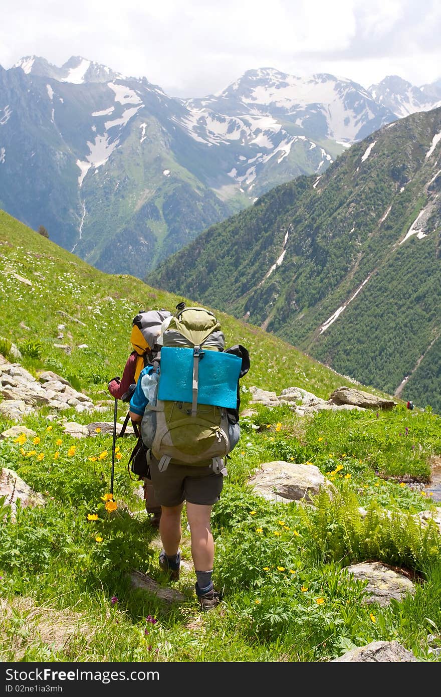 Hiker family in Caucasus mountains