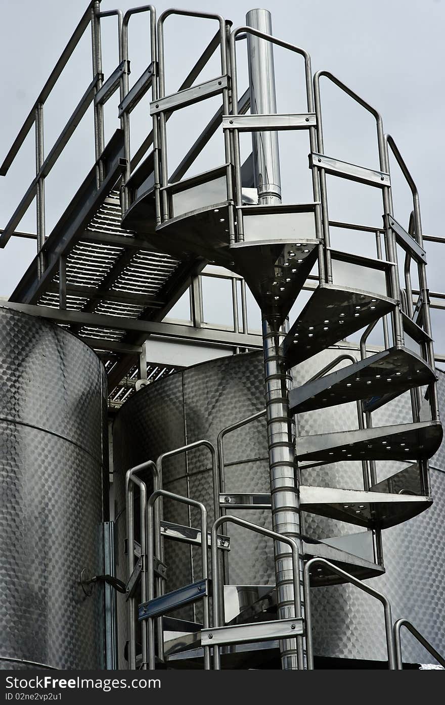 Chrome Circular Stairway & Wine Fermentation Tanks