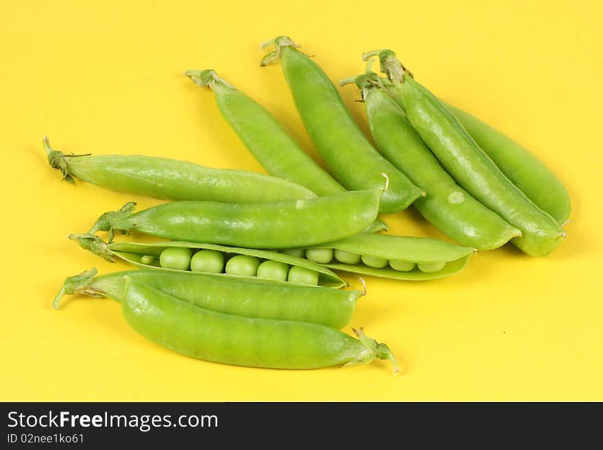 Green Pea on the yellow background