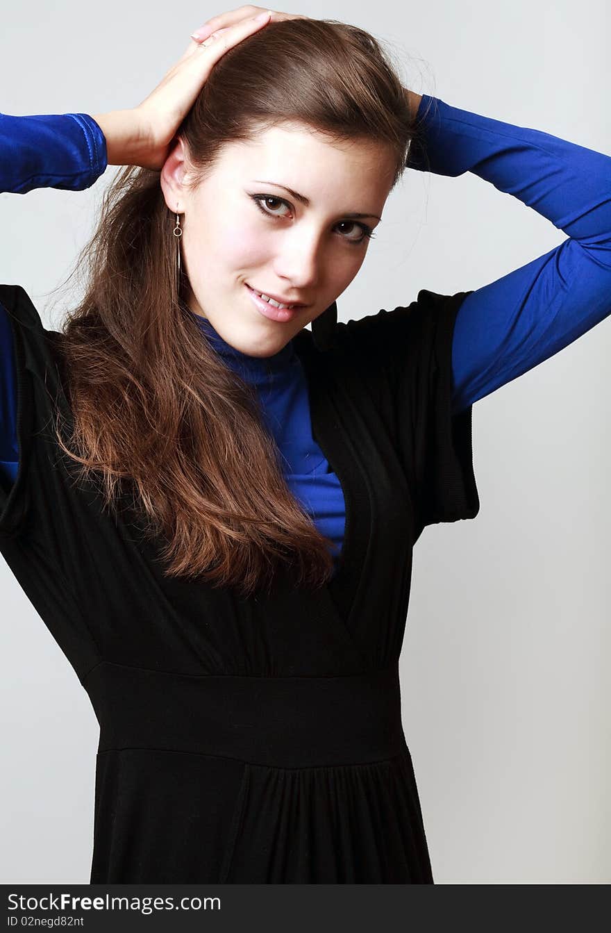 Happy young woman smiling on white