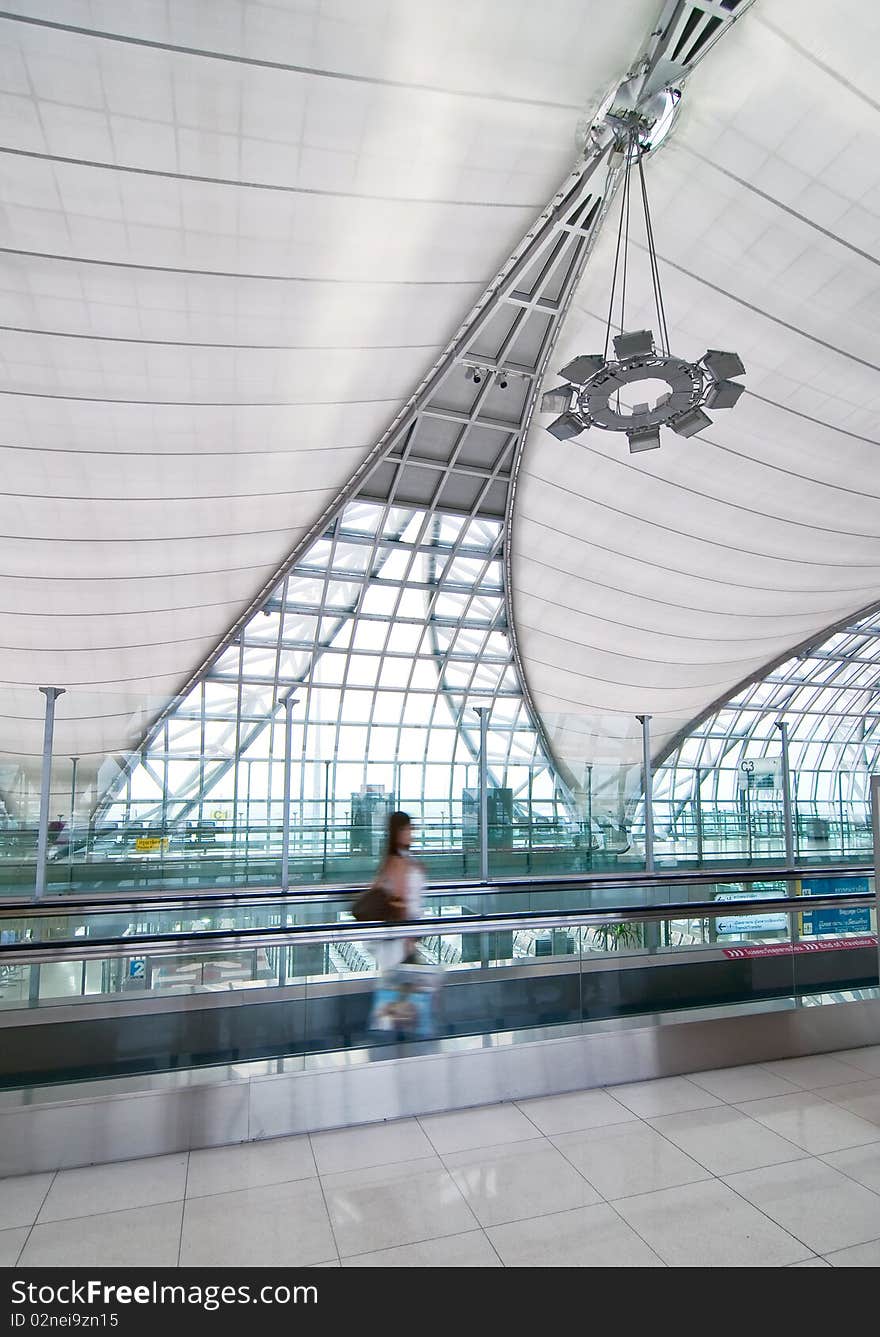 Modern interior airport with a moving passenger